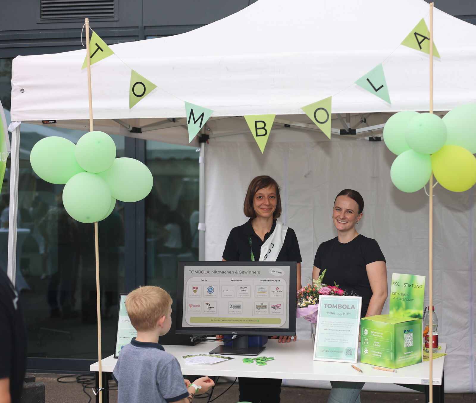 Raffle stand of the SSC Stiftung at the SSC-Services GmbH summer party